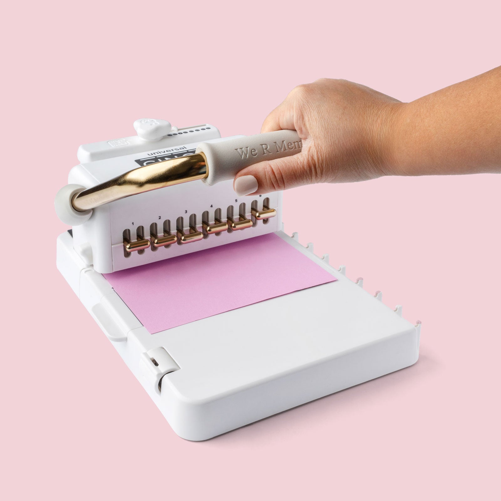 Lifestyle image of We R Makers Universal Cinch Book Binding Machine being used